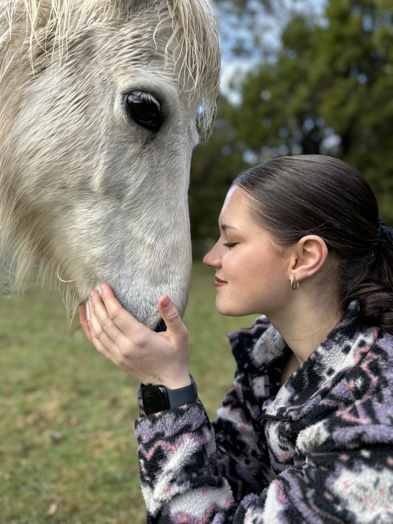 lady speaking to horses
