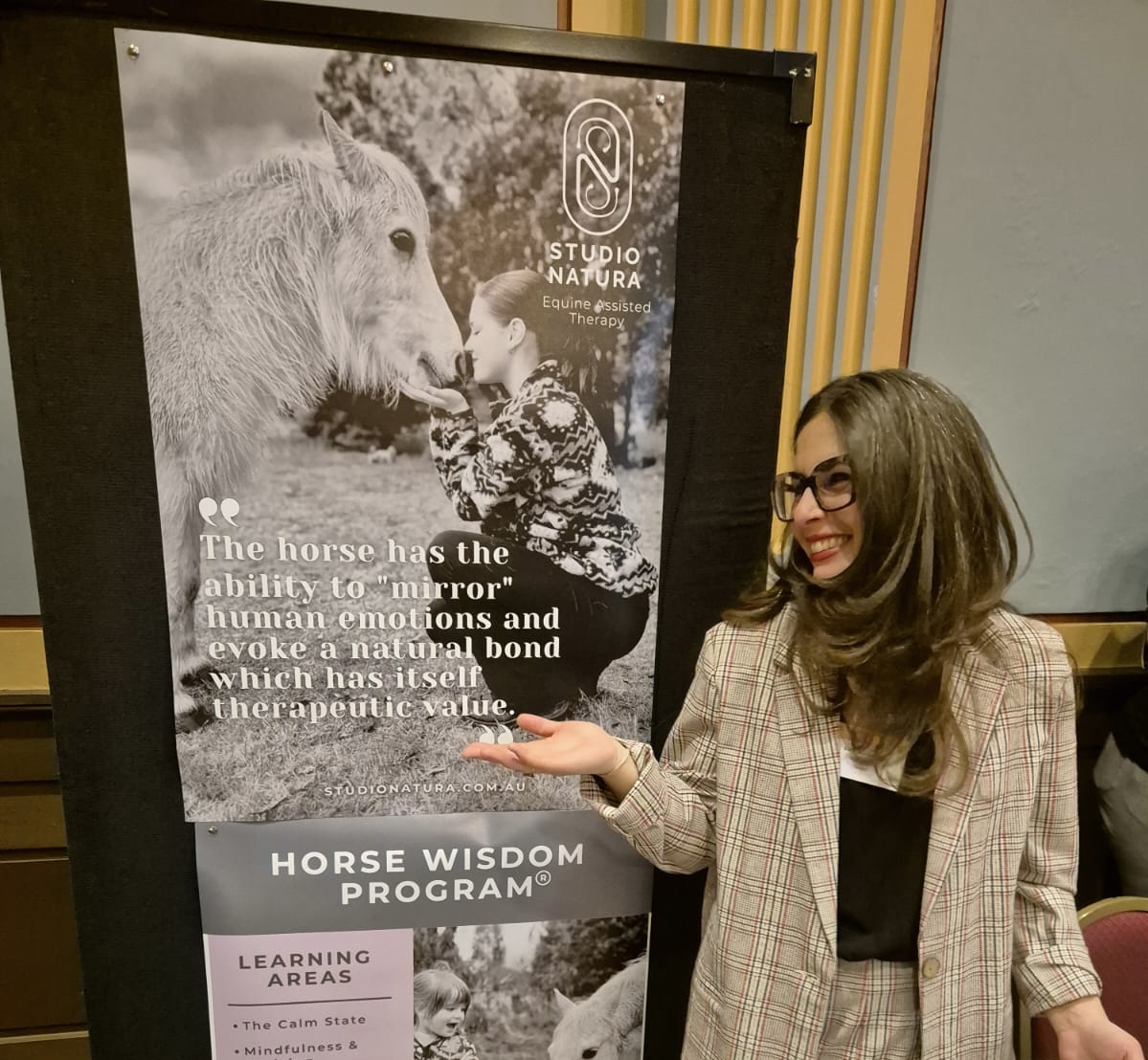 lady at the table with pc and pamphlets